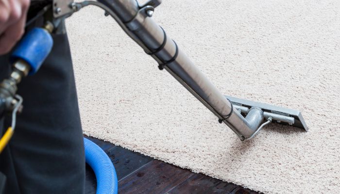 vacuum cleaning the carpet - Pineville odor removal