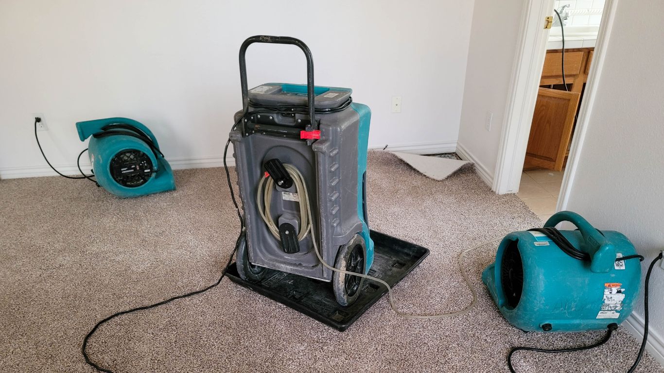 When Indoor Air Feels Heavy Dehumidification Lightens the Load Professional dehumidification equipment drying carpets and improving indoor air quality after water damage.